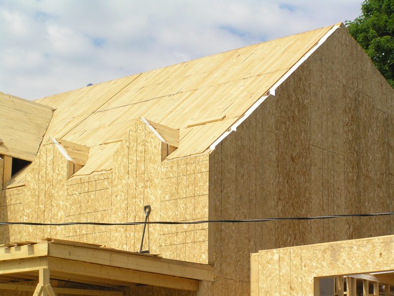 Custom home build with exterior wall SIPs and roof SIPs.