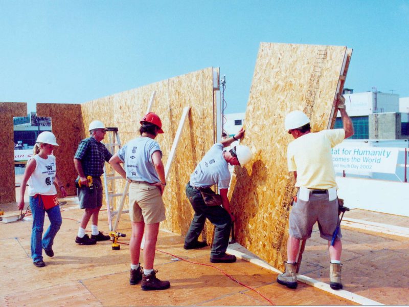 Habitat volunteers installing Thermapan SIP panels