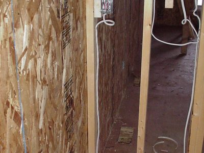 In addition to floor joists, wiring for exterior walls can be accessed from interior partitions.